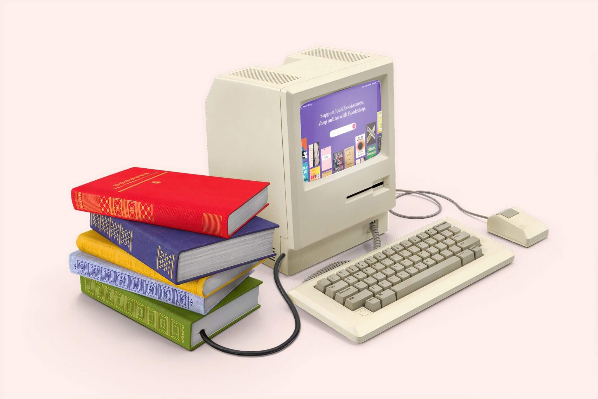 מחשב ישן לבן המחובר לספרים